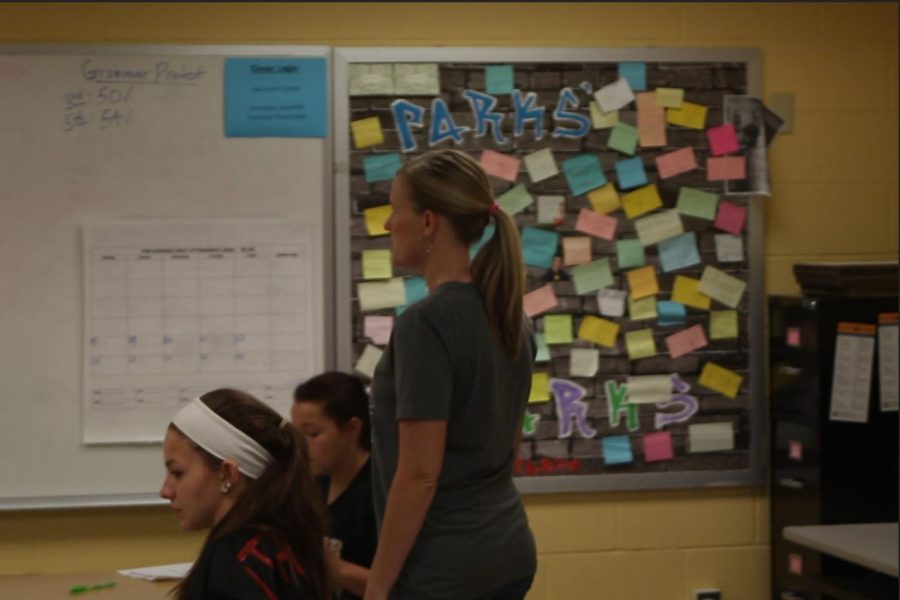 English teacher Shelly Parks works with her students in class.