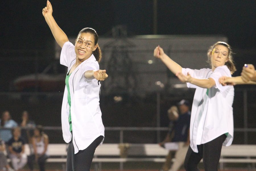 Junior Kelsey Carnes dances with Studline during the 2018 Homecoming Halftime. Carnes was on Knightline her Freshman year and then returned her junior year, after a break her sophomore year.