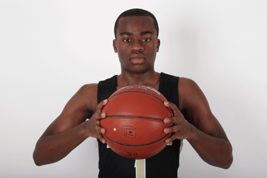 Senior Joshua Daughtery holds a basketball. Daughtery made it onto the basketball team after being cut for the past three years. 