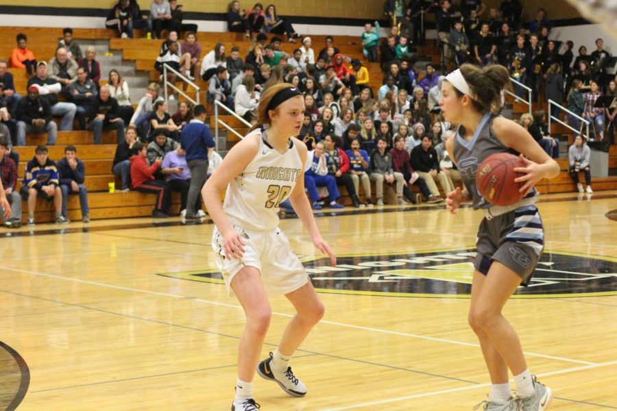 Sophomore Isabelle Delarue guards a player from Saint Charles in their game against them on 12/7