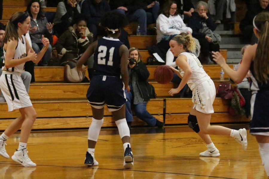 Sophomore Becka Brisette attempts to create space using a screen to get an open shot.