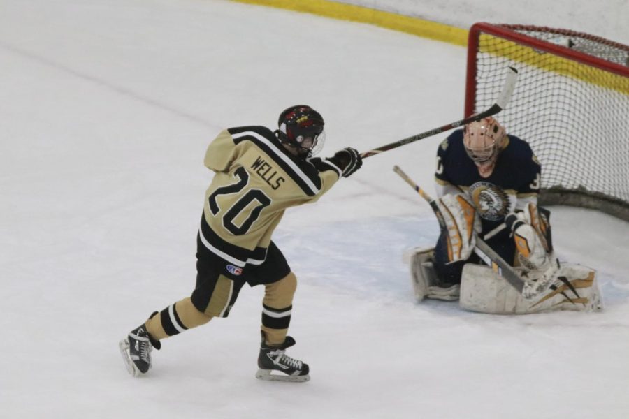 Freshman Matt Wells attempts to score a goal during their game against Holt.