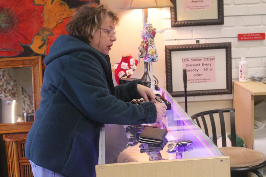 Customer Jackie B. speaks with manager Michelle Snyder as she buys a few items. Each week they receive new items from vendors like Jackie. 