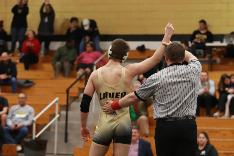 Senior Dillon Lauer gets declared the winner of his match during the duel vs. Howell