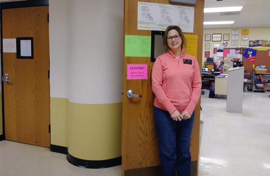 Kim Coil poses in front of her World History classroom. 