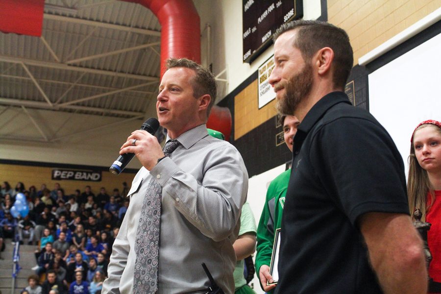 History teacher Sean Fowler receives his Teacher of the Year Award from Head Principal Nathan Hostetler. Before Fowler received his award, Hostetler introduced him in a speech listing off his accomplishments, followed by an eruption of applause from the faculty and student body.