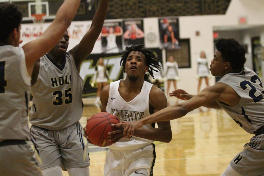 Miles Montgomery drives to the basket for a layup.