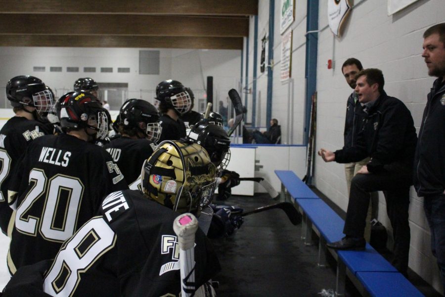 Head coach Ryan Gannon talks with his team after losing to Fox high school.