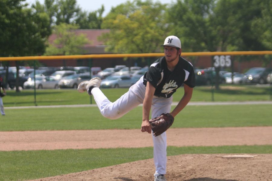 Senior Hunter Tabor pitches a baseball during a game.