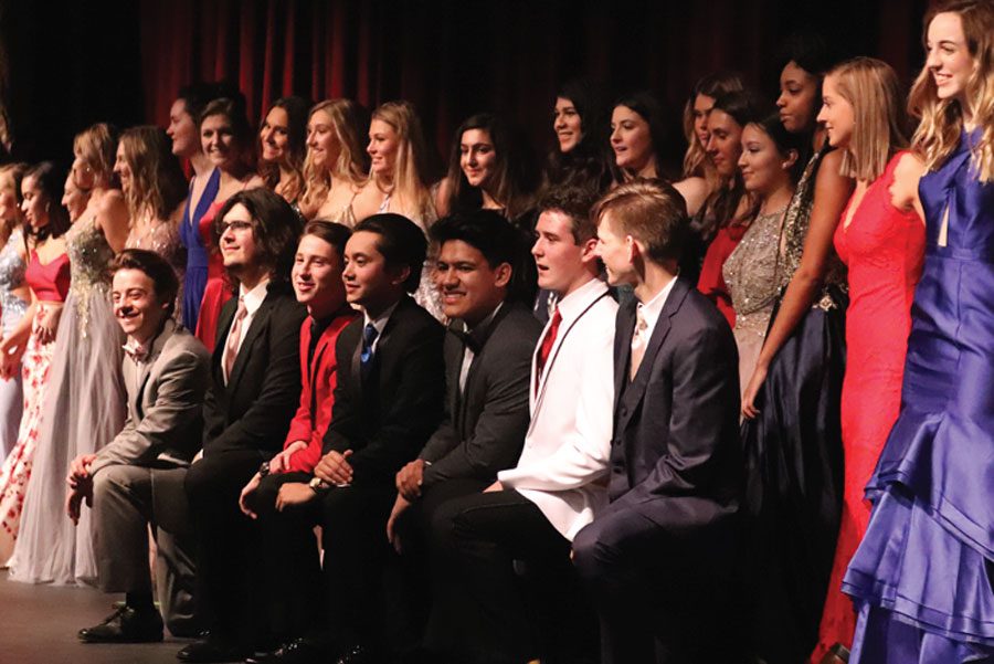 FHN students pose together and model the prom fashion trends for the year. The fashion show was hosted by the Junior Delegates to raise money for prom. The event is a chance for students to model dresses and suits from area stores.