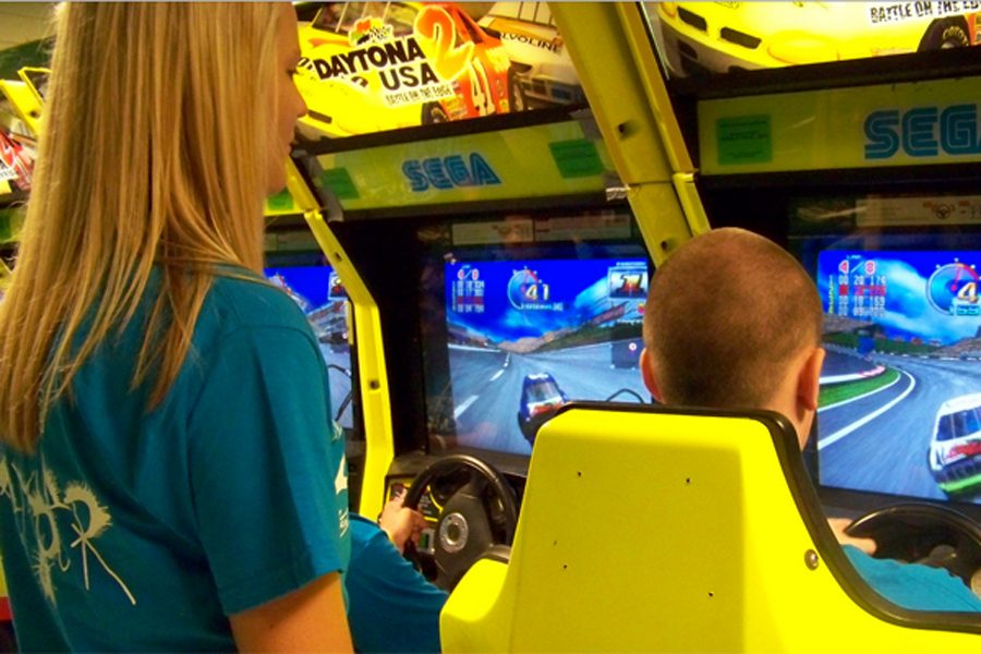 Seniors play arcade games at the annual All-Knighter senior parents put on for the graduating class.