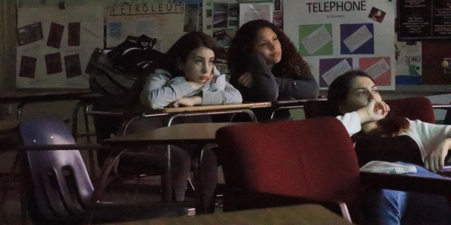 Freshmen Jessika Rogers and Makayla Hayes watch “The Ring” attentively. The club was started by Anjolina Blackwell and they meet on Thursdays to watch and discuss films. “I joined so I could watch a different type of movie, ones that I usually wouldn’t watch,” freshman DaNyla Creacy said. (Photo by Sam Waltkins)