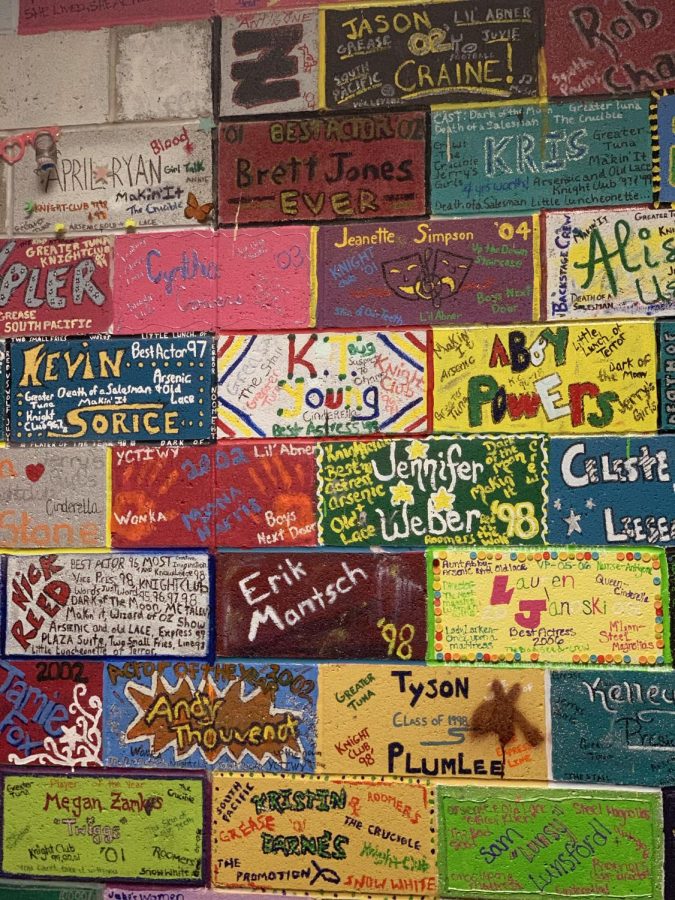 A wall of painted bricks sits directly next to the entrance to the scene shop. These are arguably the most memory-filled part of the scene shop, as they were painted by seniors as far back as the late 80s. Every senior who has since passed through the drama room has painted a brick, and the bricks extend all the way to the very back of the shop.