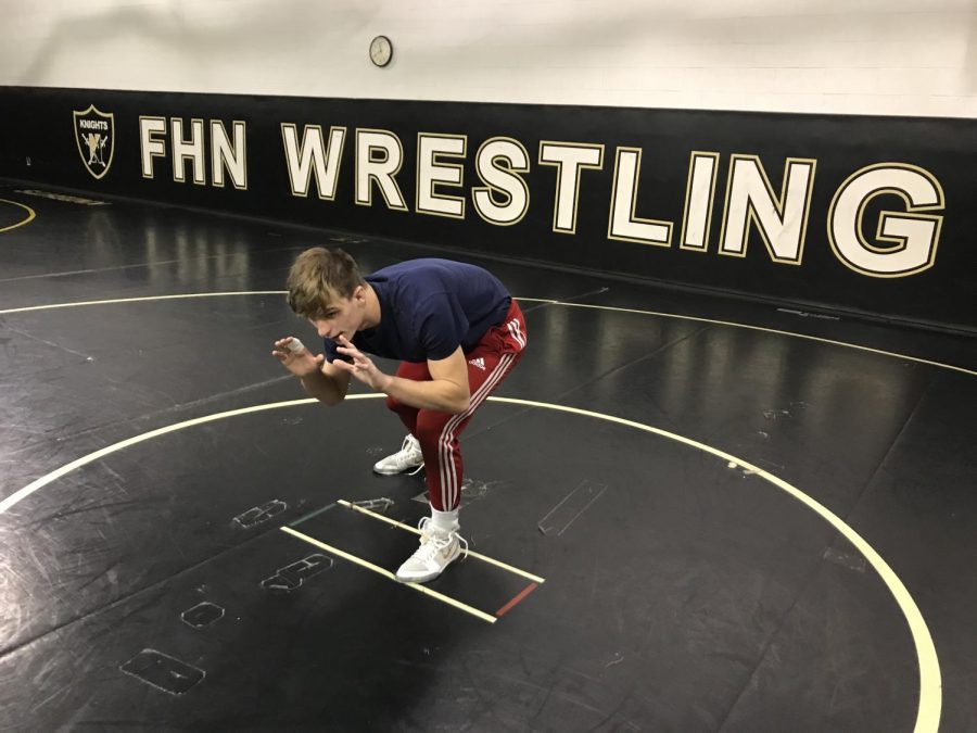 Senior Jeremiah Meter prepares for wrestling practice.