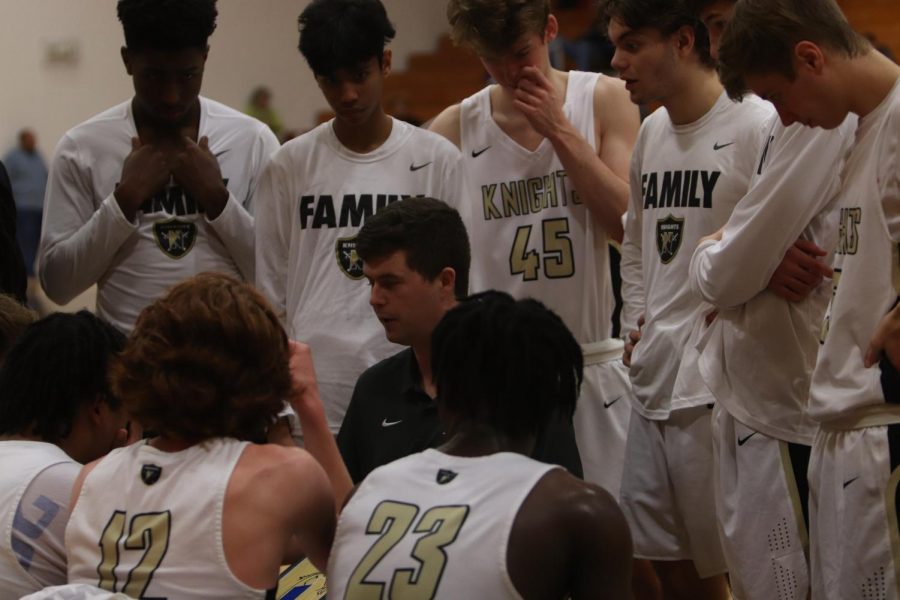 Varsity Boys Basketball Races For The Ball Against Liberty