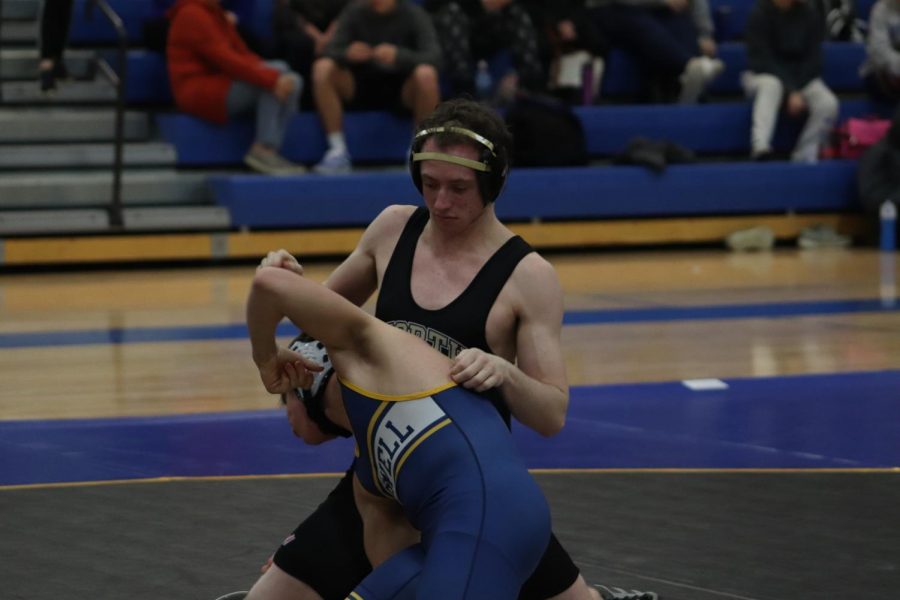 Junior Ryan Long wrestle's opponent at Howell wrestling meet.