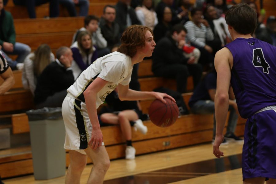 Senior Rhett Pruett dribbles the ball and looks for an open teammate. Pruett has played all four years for FHN. 
