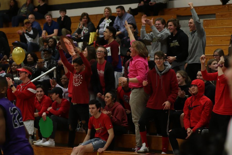 The school's non-official cheerleaders, The Goonies, cheers after the team scores a basket.
