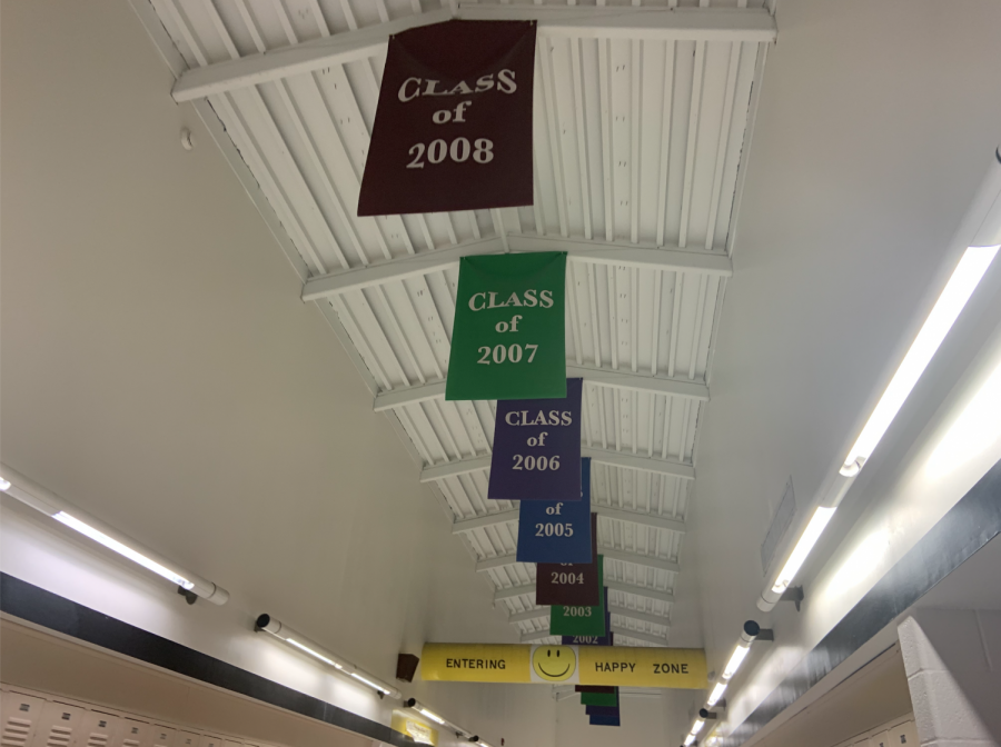 Senior banners hang on the ceiling of the top floor at FHN. Each banner is printed with both the senior class's year and their selected quote.