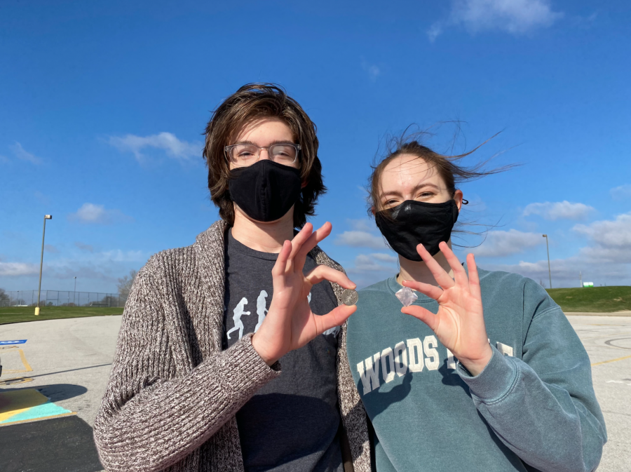 Seniors Marcus Otto and Emma Rohrbach hold up a quarter and a crystal respectively. Their crystal placed fifth nationally. (Submitted photo.)