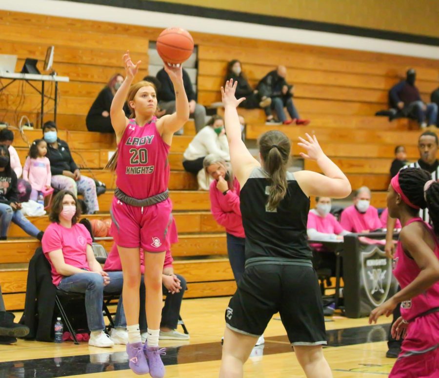 Senior Isabelle Delarue shoots the ball from the 3-point line. Delarue led the team in nearly every statistic this season, and is playing for Missouri State University next year, the 21st ranked program in the country. Delarue also broke the school's all-time points scored record during this game.