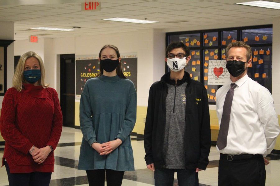 Award winners Emma Rohrbach and Jay Scott stand between principals Katie Greer and Nathanael Hostetler.