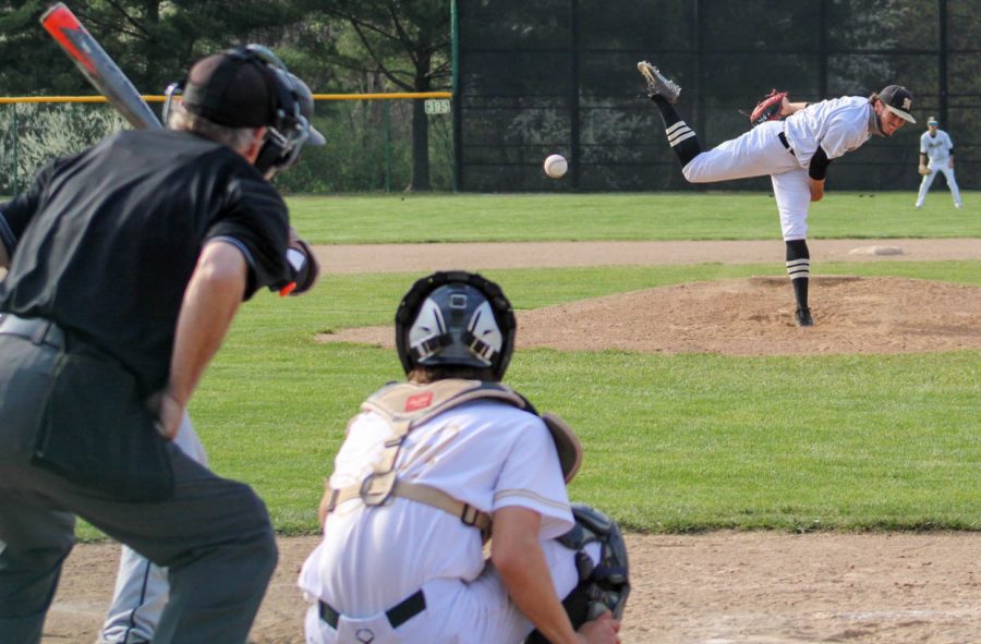 Senior Jackson Mitchell pitches the ball during a game.