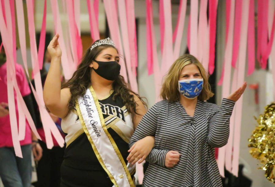 Senior Brooke Wright waves to her friends and teammates on Knightline's Senior Night.