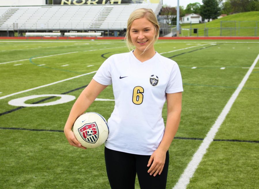 Senior Ella Pardo poses with a soccer ball on the field. As the school year comes to a close, so will her time as an FHN tri-sport athlete.