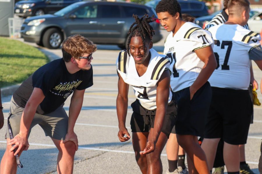 The football team plays washers after their scrimmage.