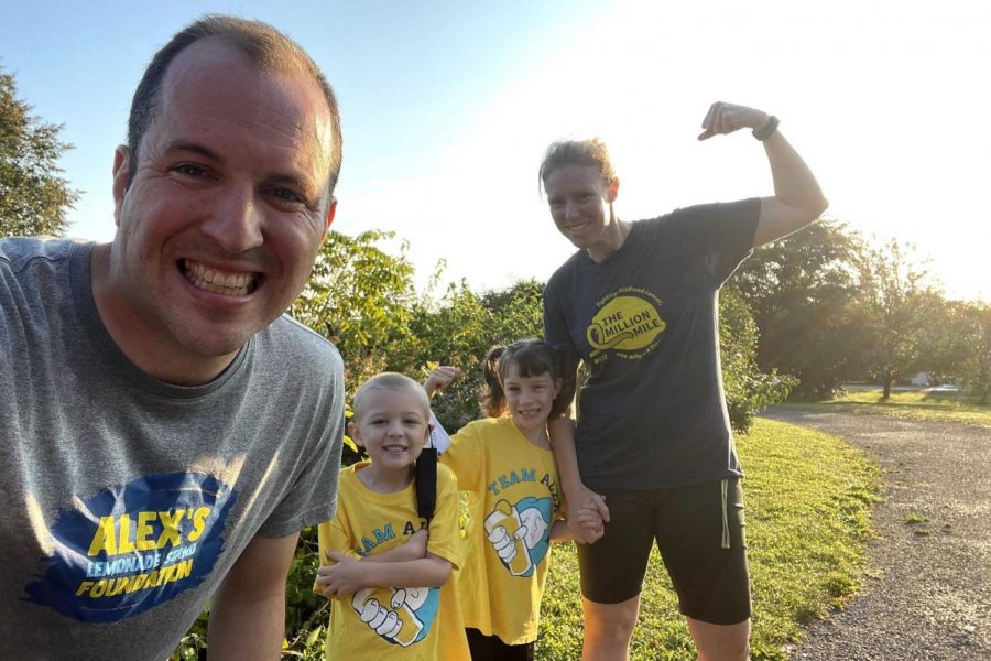 Liam Baine poses with his family for a photo together. 