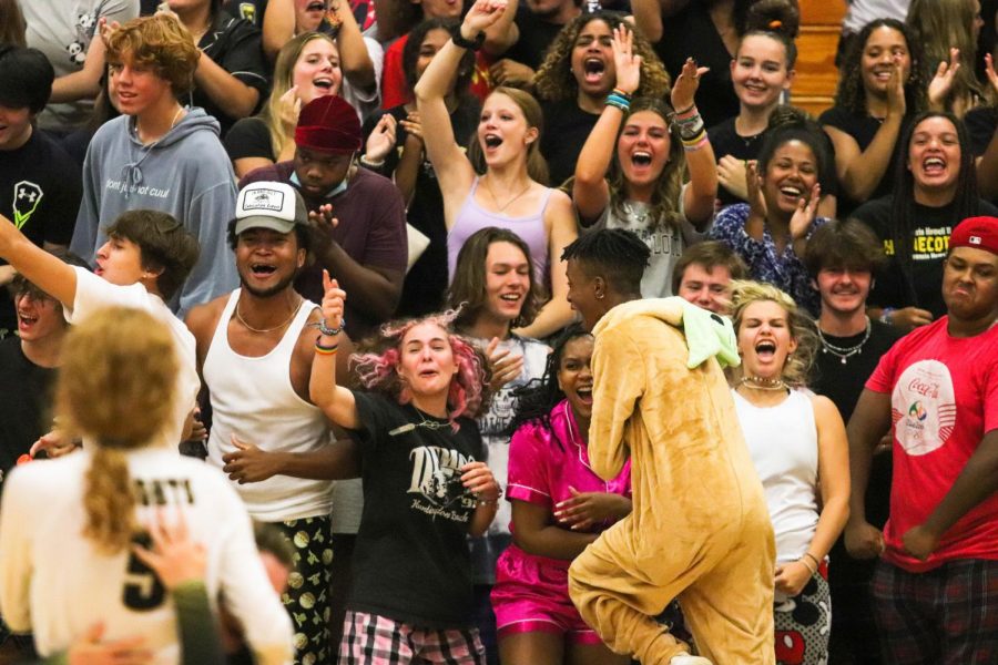 The Goonies and the student section cheer on the team after they won a point. 