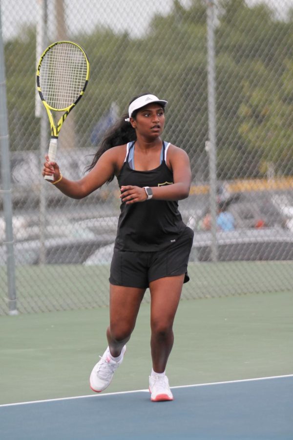 Varsity player Jayati Karre prepares to serve the ball to the other team. Previously at GACS, she placed 4th