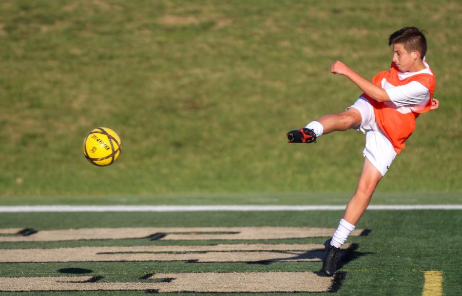 A player from North's JV soccer team kicks the ball during a game on Oct. 19