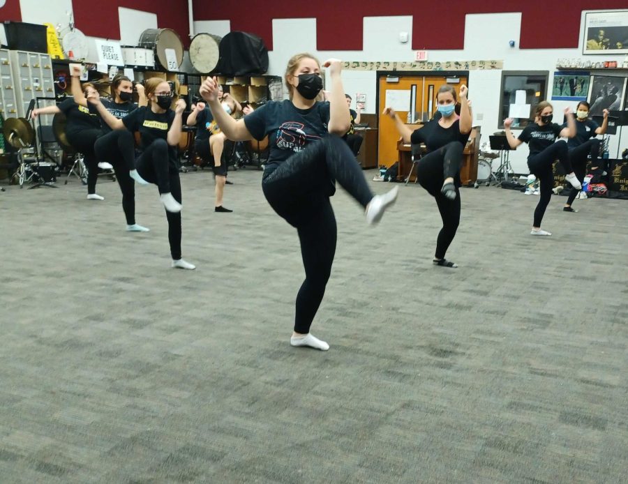 The Winter-Guard team practices their performance after school