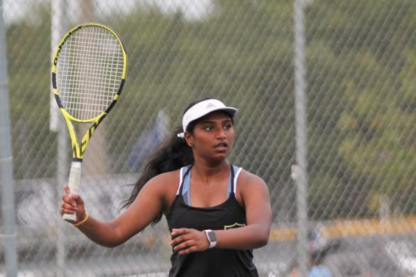 Jayati Karre prepares to swing her racket during a match