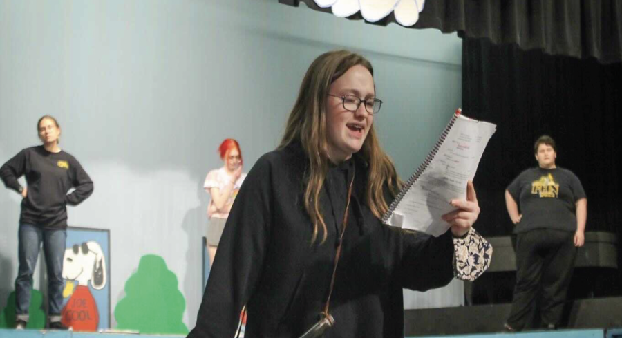  In the FHN auditorium, junior Piper Orzel rehearses a scene from the fall musical, You’re a Good Man Charlie Brown.