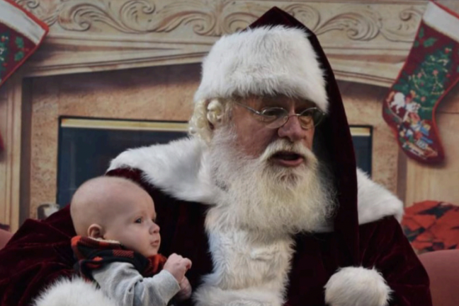 A baby sits on Santa’s lap during the
Leible’s 2020 Santa Night. Children are
allowed to sit on Santa’s lap to give him
their Christmas lists.