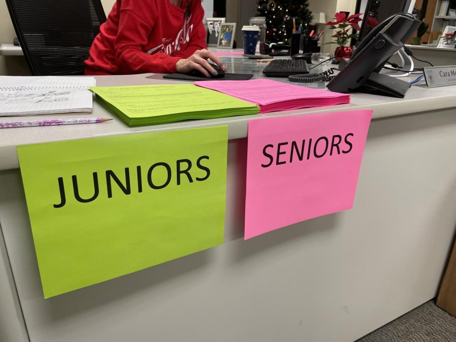 Final Exam exemption sheets sit on a desk inside the main office.