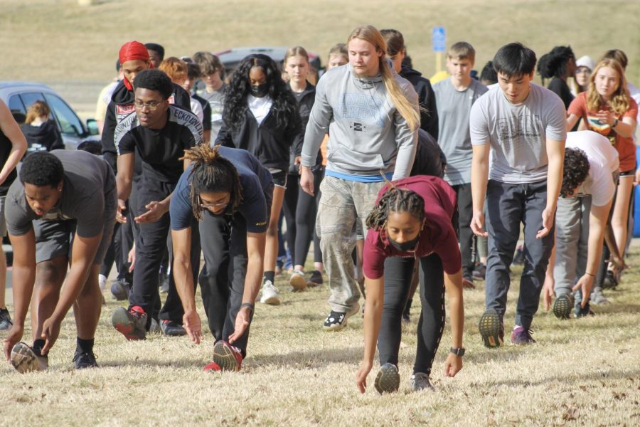 The FHN track and field team stretches and does drills. The track team is split up into several team. These teams are: long distance, sprints, jumps, pole vault and throwers. All teams except the long distance team have to practice at Francis Howell Centrall due to the lack of a track at FHN.