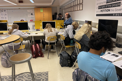 Students sit in class in room 105 on March 4.