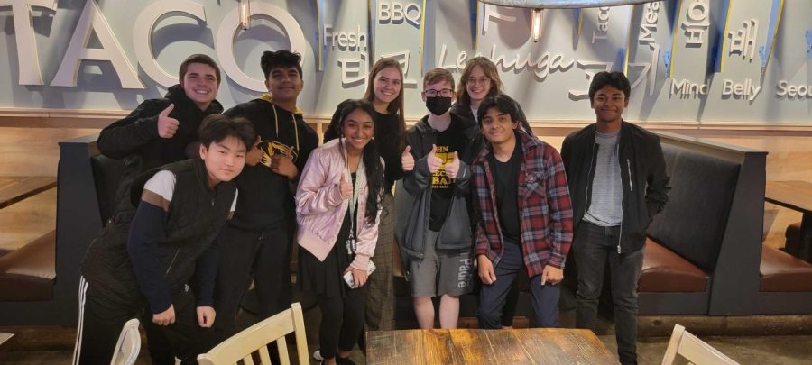 Following a competition at Ladue High School, Speech and Debate members Carter Houdeshell, Jay Choi, Sagar Singh, Amoolya Pandurangi, Evan Becker, Pavan Kolluru, Carly Gordon, Rylie Miller, and Puneet Sontha take time for a photo at Seoul Taco where they had dinner. 