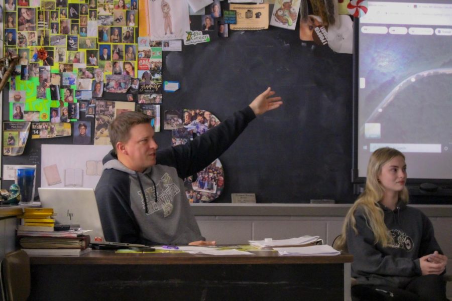 Ecology club sponsor Joseph Brocksmith points to the smart board during a lesson.