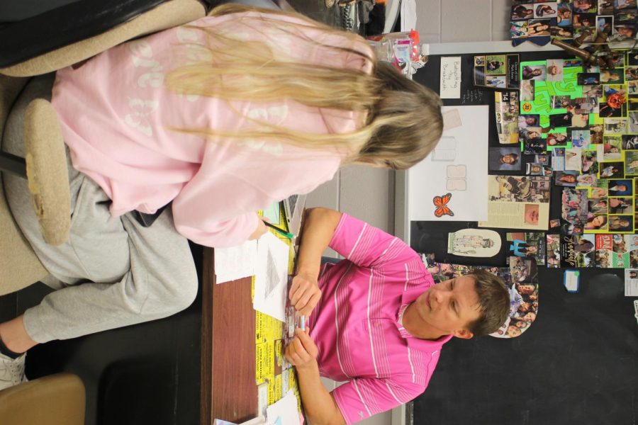 On April 21, Joseph Brocksmith shows students, including his daughter Kaylee, how to identify soil types on a worksheet at his desk during 4th hour environmental science. Kaylee has her father as her teacher for the 4th hour, and occasionally sees him throughout the day. (Photos by Andrew Poertner)
