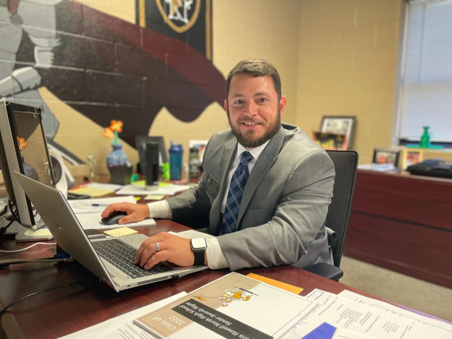 Mr. Jeffrey Fletcher sits in his office. 