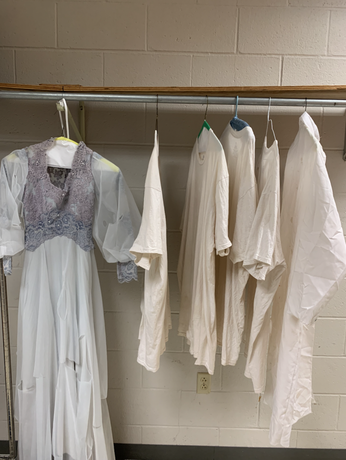 Drama Club's costumes for the escape room hangs in their closet. 