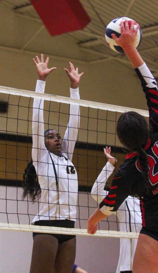 On Aug.31, Freshman Alissa Simon blocks the ball hit by a FZS player during a FHN home game. 