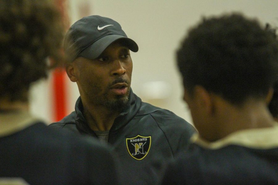 JV Boys Basketball Coach Cory Patterson talks to the team during a game on Dec. 2. Patterson is new to the team as head coach and is already well respected by his players. Patterson began coaching this year in place of Coach Jordan Martin who coached last year. 