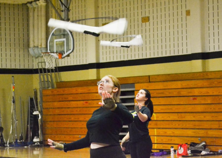 On November 16, the FHN winterguard practices together in the small gym. Captain Madelyn Clark leads drills with the other team members on rifle. This year’s show is titled Bound by Love. 
