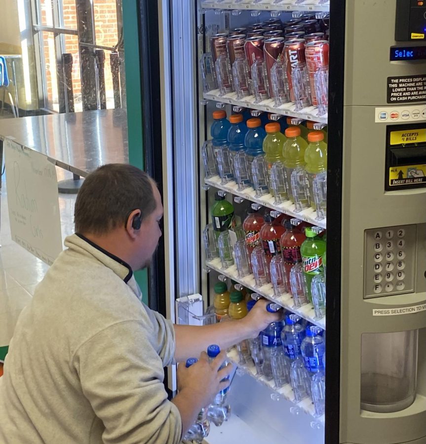 On Nov. 17, a vending machine stocker stocks the machines in the school by the cafeteria.